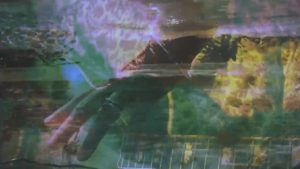 Rebecca Barnard, frame from "Black Coral" music video
